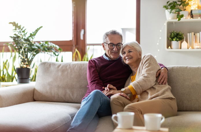 An older couple smiling as they are ready to apply for a CHIP Reverse Mortgage.