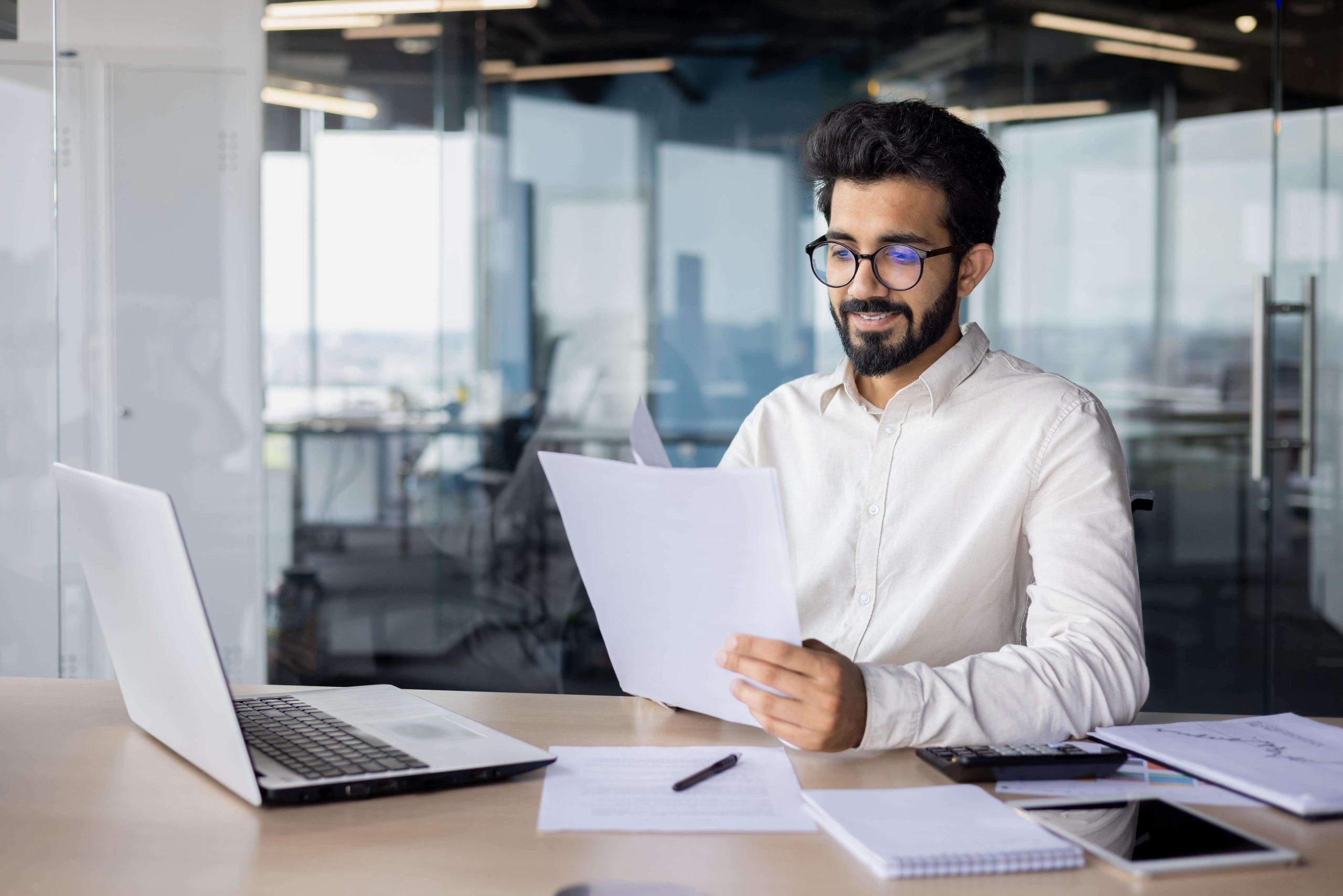 A broker analyzing the documents and forms from CHIP Advisor to help their clients.